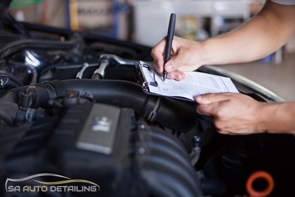 Vehicle Inspection at San Antonio Auto Detailing Shop